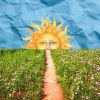 camino sobre fondo azul con sol al fondo